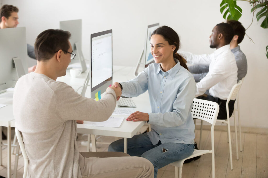Payroll Outsourcing Services in Chennai 2 Smiling Woman Handshake Deal 1 1